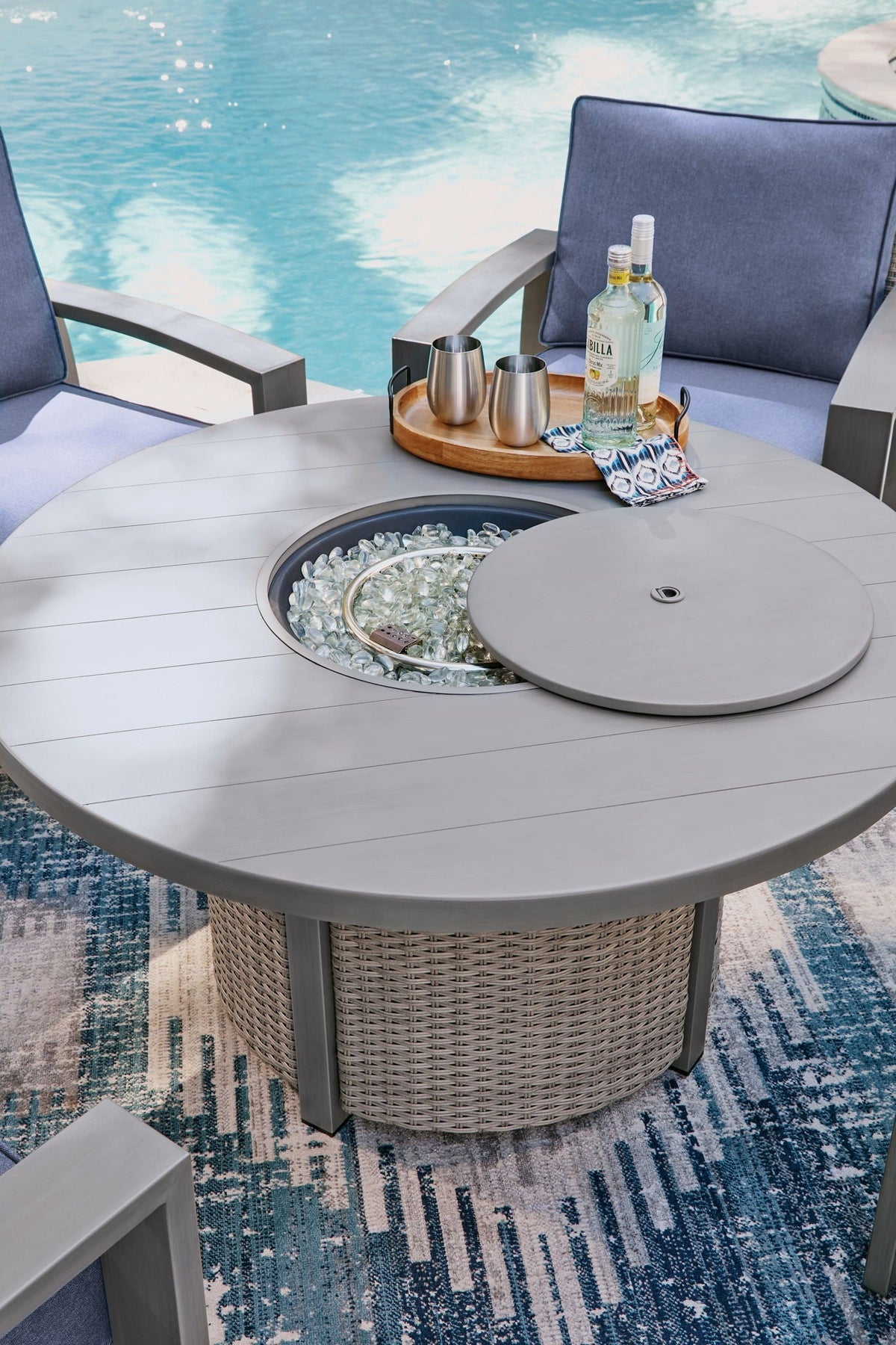 Half Moon Beach - Round Fire Pit Table - Gray - Select Living Furniture - Fire Pits - Signature Design by Ashley® - PCP418-776 - Half Moon Beach - Round Fire Pit Table - Gray -